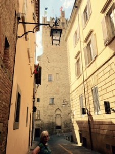 Ann in front of the tower of the Palazzo Communale Arezzo.