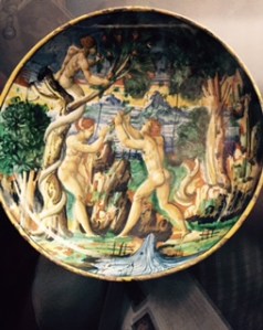 an early porcelain plate from the Fredi collection which shows an Eden scene with the serpent actually shaking the fruit free from the tree of the knowledge of good and evil!