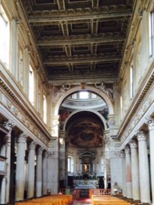 St Barbara's Romanesque church in Mantua closely related to the Ducal Palace; wooden roof, simple Romanesque structure with elegant columns headed by Corinthian capitals.