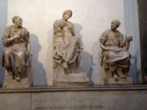 Signed Michelangelo sculpture (middle statue) in the New Sacristy of the Medici Chapels in San Lorenzo Florence. Vasari put these statues over the very plain tomb of the Duke of Urbino (Lorenzo the Magnificent's grandson)