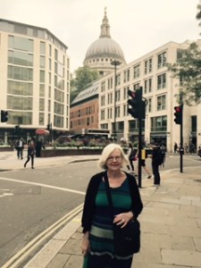 Ann hugging up in London's 19 degree Summer rainy day with St Paul's in the distance