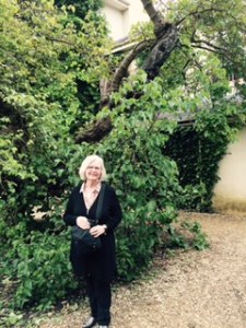 Ann beneath the very old mulberry tree which grew up and across Darwin's study window on the second floor of Down House. He refers t the tree in his notes