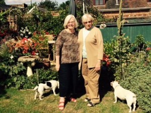 Ann and Joyce with Badger and Harvey in the garden at Forge House Frinsted