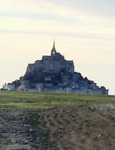 Mont St Michel monastery appearing over the horizon in early evening. An absolutely stunning sight.