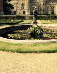 Penshurst Place oval pond well stocked with fish in the centre of the formal parterre garden