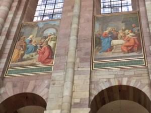 Two of a large group of Speyer cathedral frescoes high above the nave.