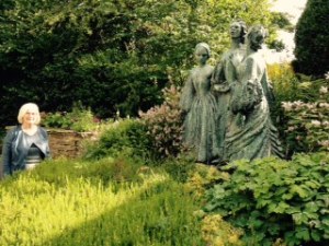 Sculpture of the three surviving sisters in the rear garden of the Parsonage