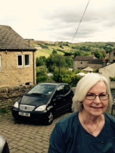 Ann still smiling after climbing the hill to the Bronte Parsonage