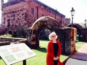 Ann at the door of the old abbey with the chapter house beyond